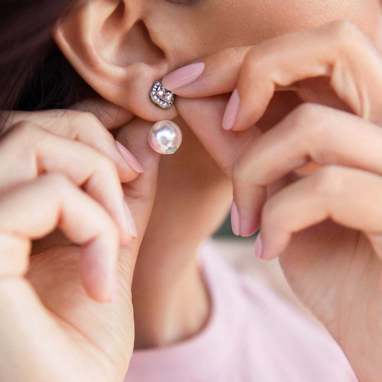 Close-up of model's ears wearing Chrysmela Duchess Pearl Earring Jackets